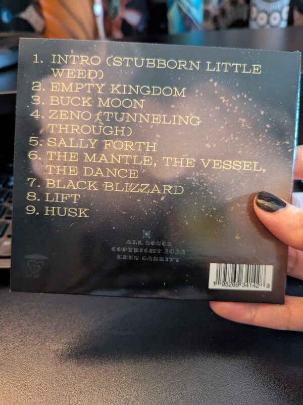 the reverse side of the CD with track listing: 1. Intro (Stubborn Little Weed) 2. Empty Kingdom 3. Buck Moon 4. Zeno (Tunneling Through) 5. Sally Forth 6. The Mantle, the Vessel, the Dance 7. Black Blizzard 8. Lift 9. Husk